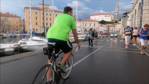 Man Riding a Bicycle in the Street