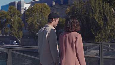 couple enjoying city view from a bridge