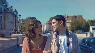 tourist couple walking around the city holding hands