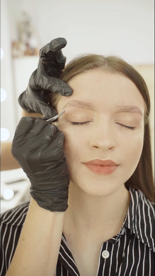 Model Getting her Eyebrows Done