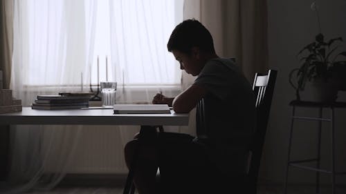 Boy Self-studying at His Home