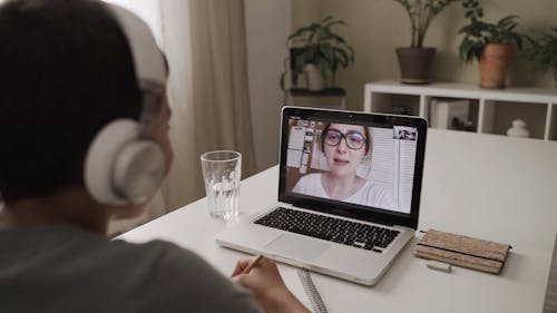 A Teacher Teaching Her Students Via Video Calling