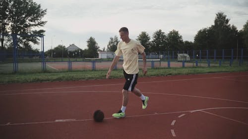 A Man Playing Basketball