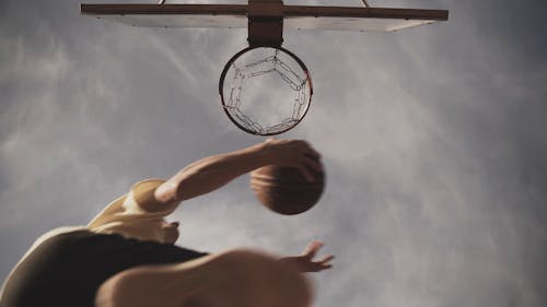 Low Angle View of a Man Playing Basketball