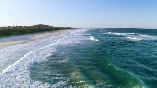 Waves Kissing The Beach Shoreline