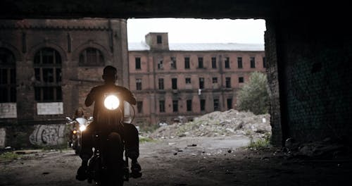 Bikers Leaving An Abandoned Property