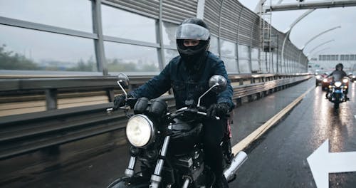 Bikers Ring On A Wet Road