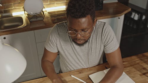 A Man Typing On His Laptop Keyboard