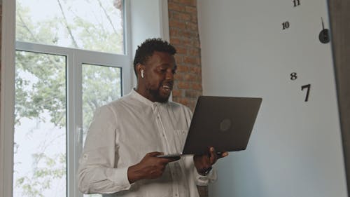 Guy attending Video Call on his Laptop