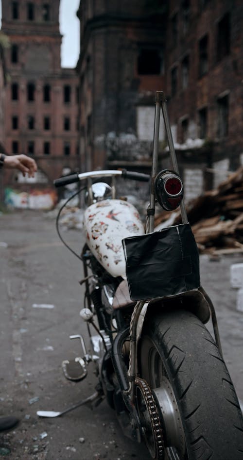 A Man Mounting His Motorbike To Ride