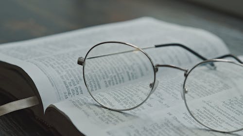 Close-Up View of Eyeglasses on an Open Bible