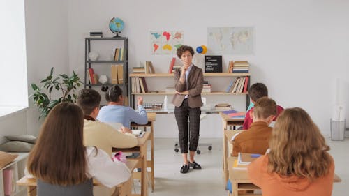 Female Teacher Giving her Lecture in Classroom 