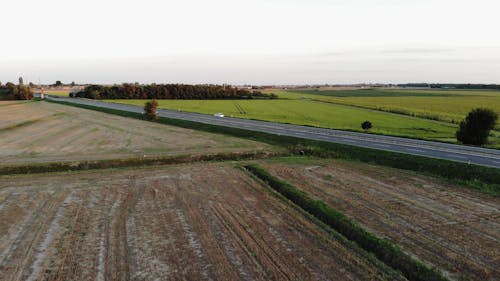 A Highway In The Middle Of An Agricultural Land