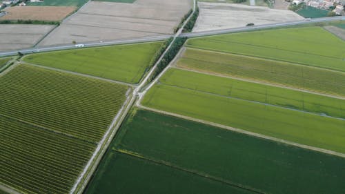 A Highway Built Across An Agricultural Area In THe Countryside