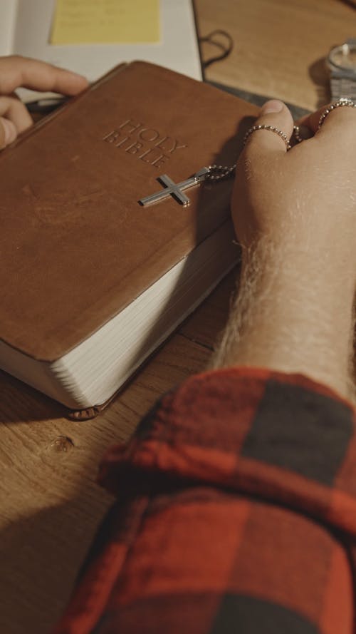 Man with Holy Bible and Rosary