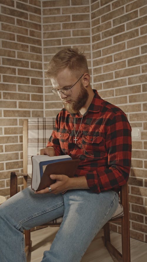 Man Reading A Bible