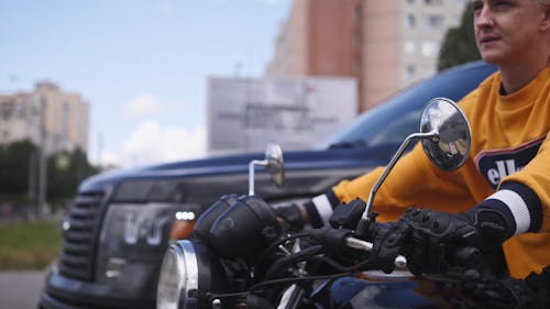 Close Up View Of People Riding A Motorcycle