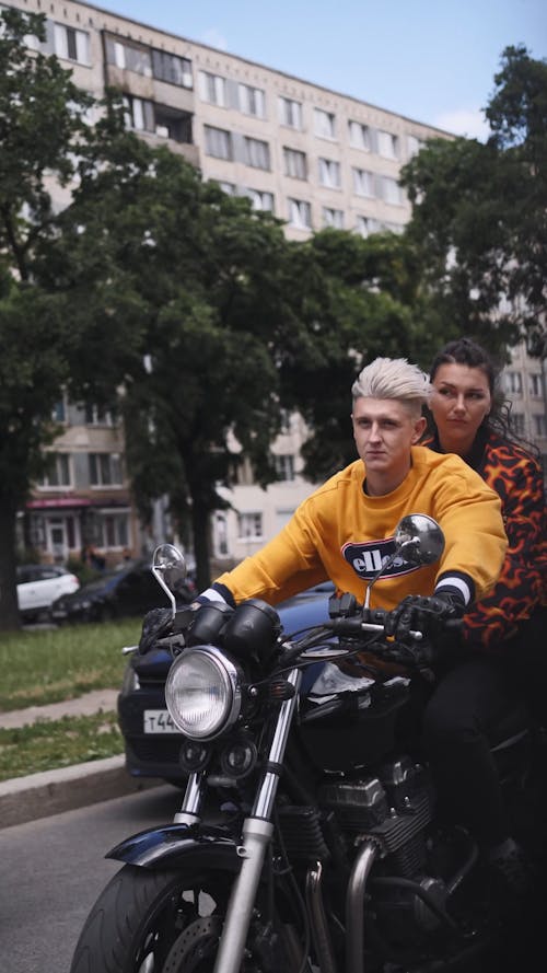 A Couple Riding A Big Bike On The City Road