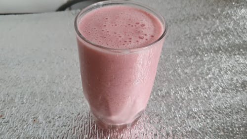 Close-Up View of Strawberry Smoothie in a Drinking Glass