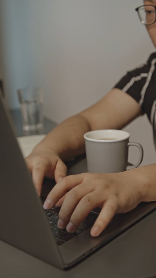 Person Working on the Laptop