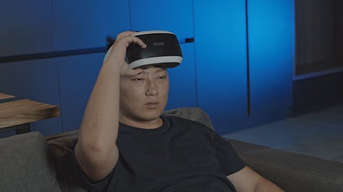 A Man Using Virtual Reality Glasses