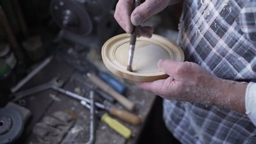 Person Making a Wood Craft