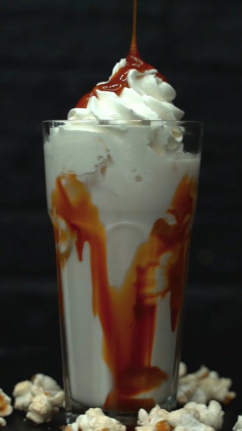 A Vanilla Smoothie with Caramel Syrup on Top