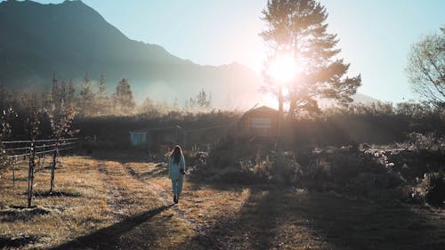 Beautiful View of a Woman Walking at Remote Habitat