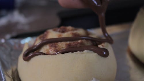 Chef Dressing Pudding with Hot Chocolate