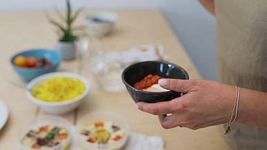 a woman preparing a meal