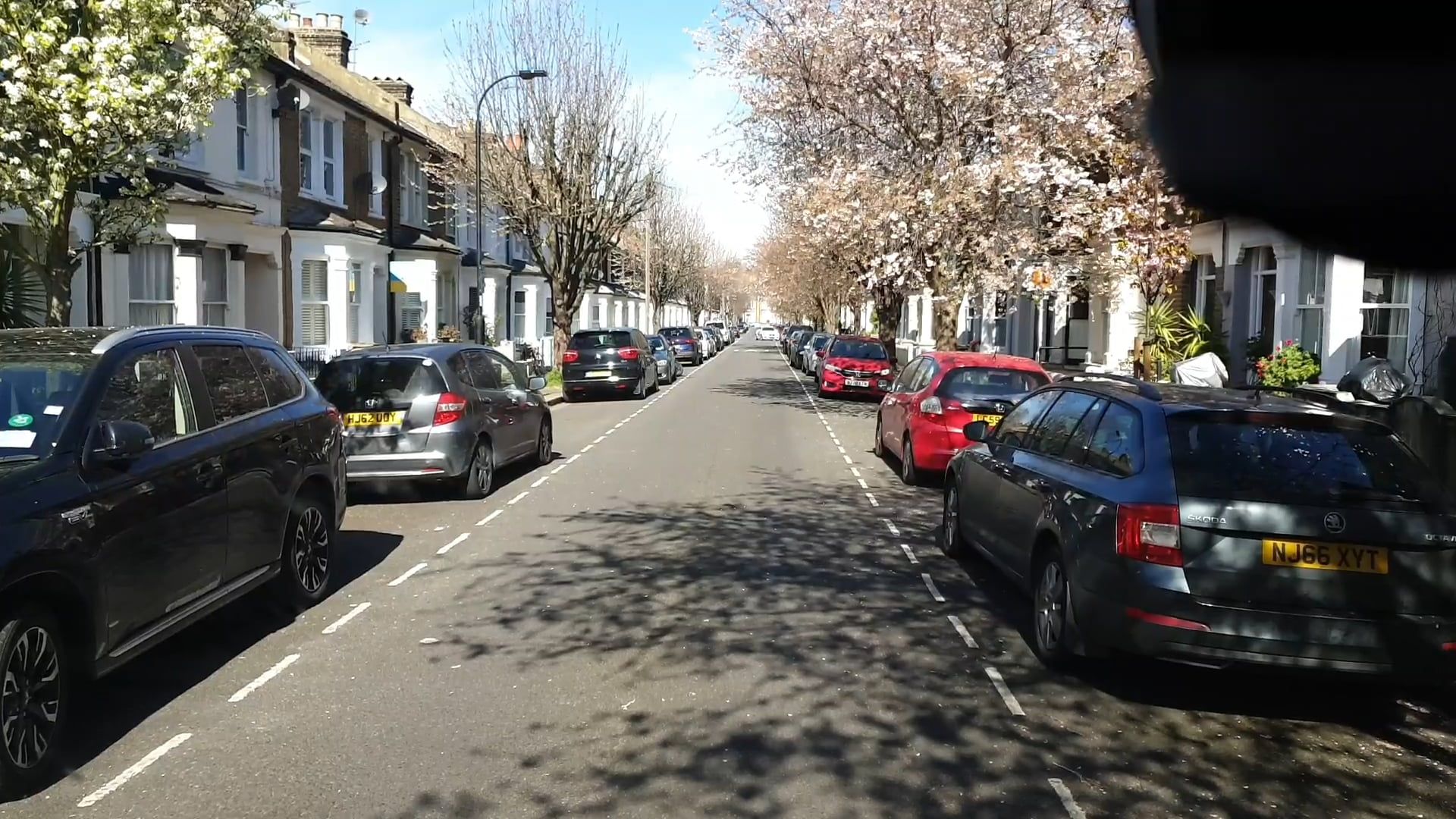 Cars Parked on Both Side of a City Road · Free Stock Video