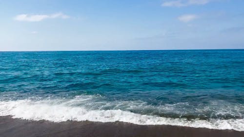 View of Blue Ocean Waves coming to the Shore