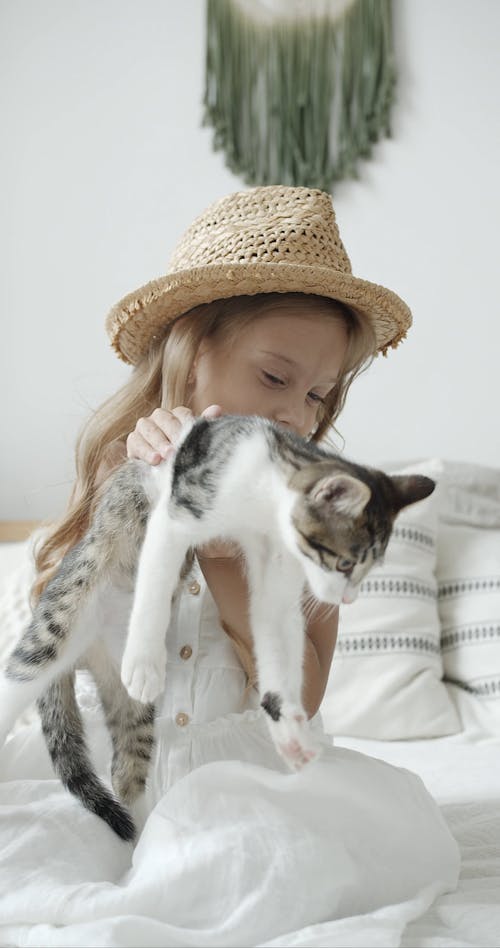 Girl Holding a Cat
