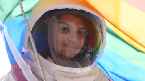 Female Astronaut With a Gay Pride Flag