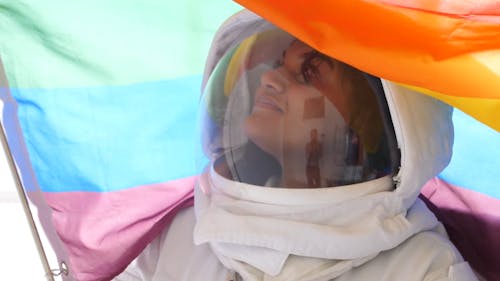 Female Astronaut With a Gay Pride Flag