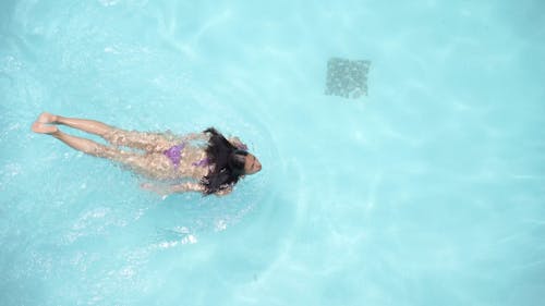 Aerial View of a Gorgeous Lady Swimming in the Pool