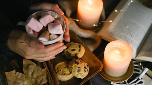 Woman Holding a Cup of Marshmallow