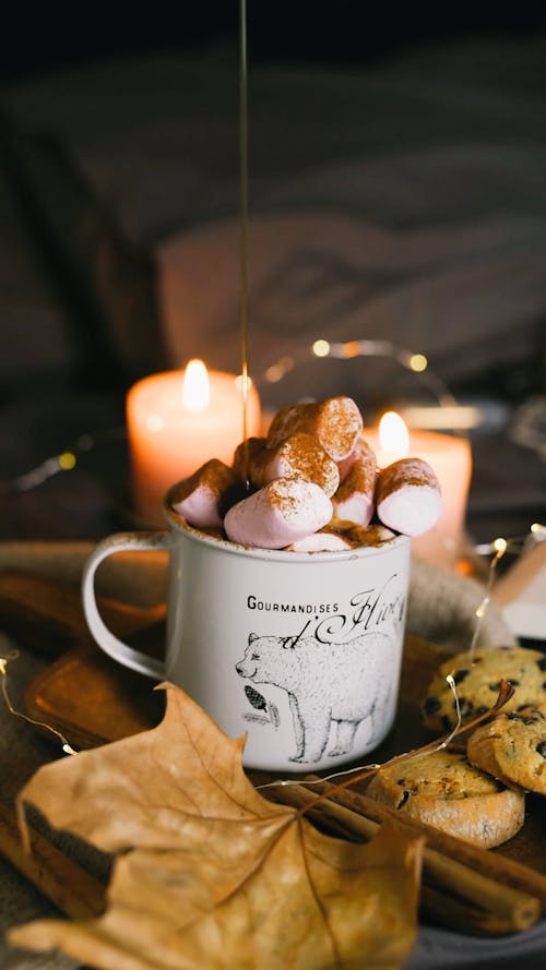 Pouring Caramel on Marshmallows on a Mug