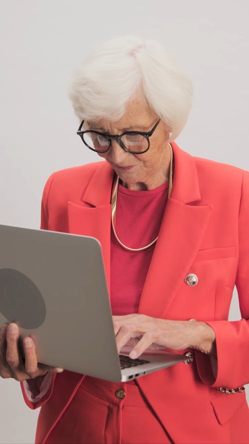 Stylish Old Business Woman Working on Laptop