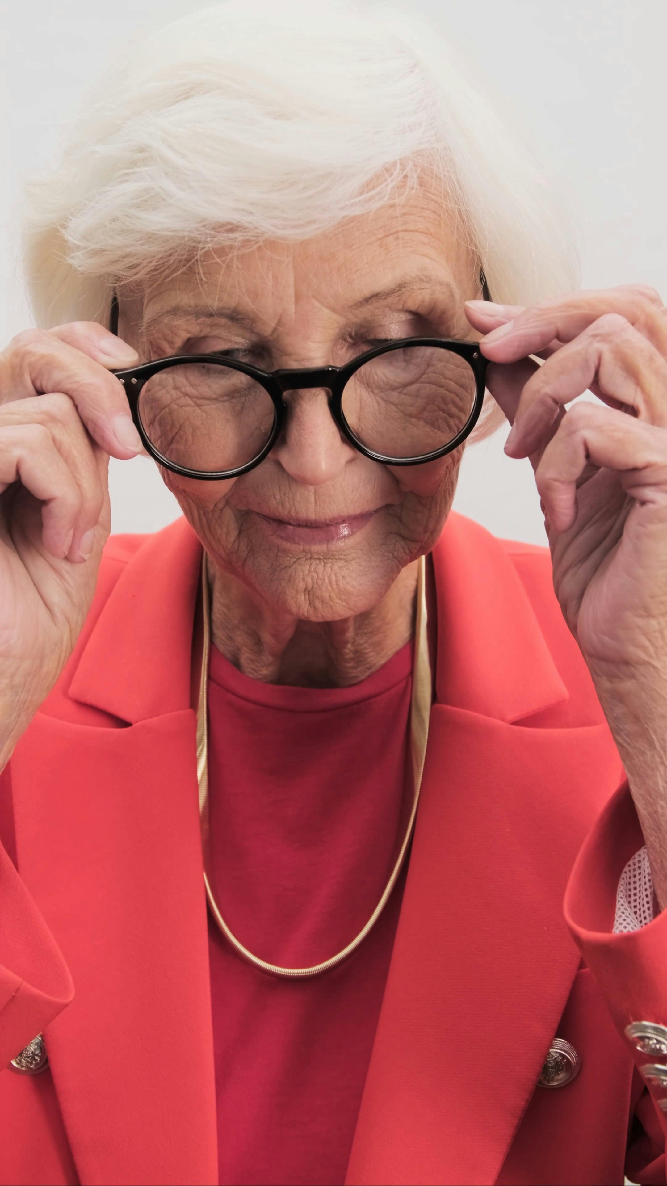 Elderly Female Model Putting her Eye Glasses on · Free Stock Video