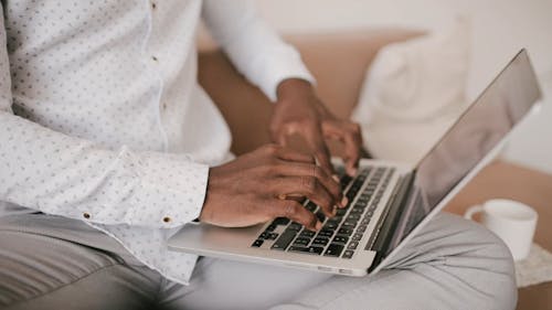 Close-Up View of a Person Using a Laptop