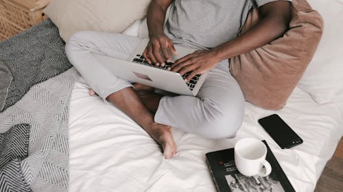 High Angle View of a Person Working on his Laptop