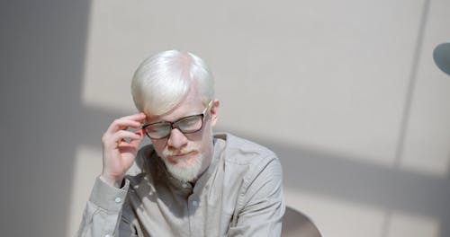 A Man Checking His Glasses