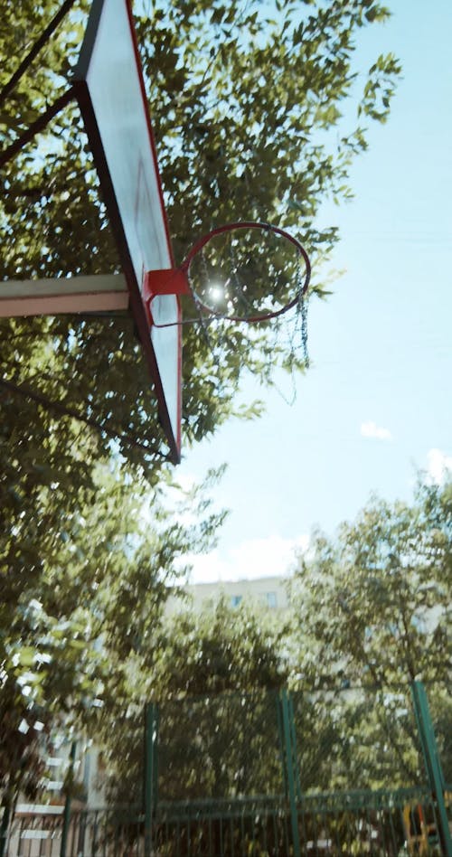 A Man Dunking a Basketball