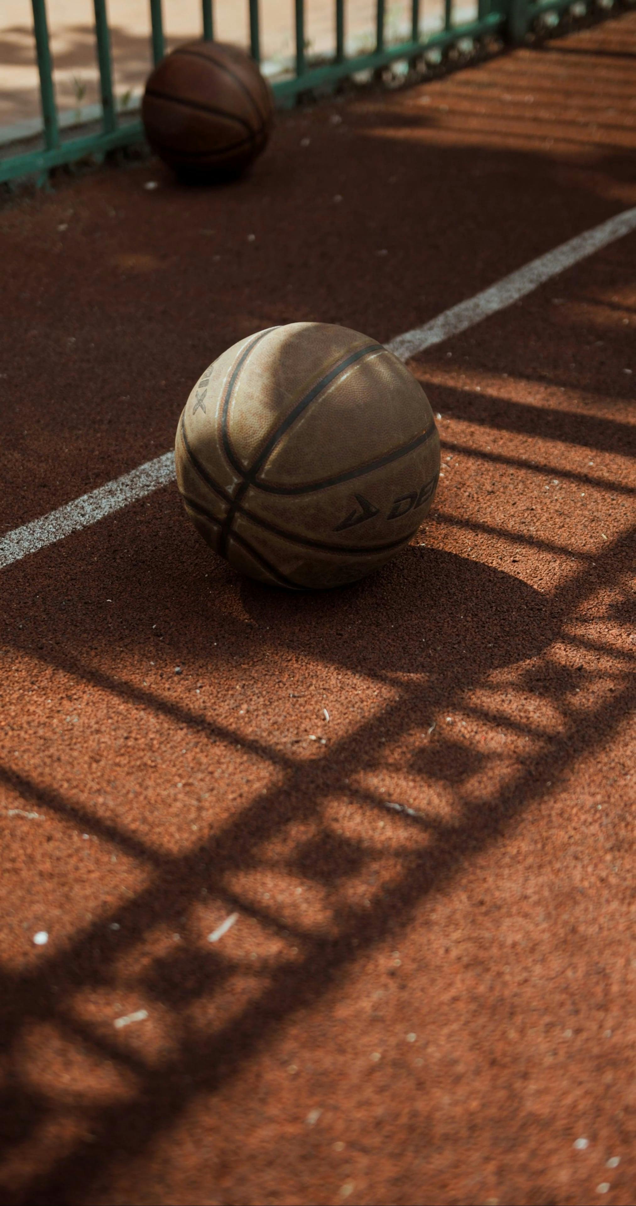 Two Basketballs on the Ground · Free Stock Video
