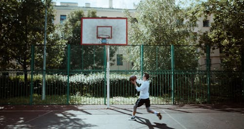 Player Doing a Reverse Layup Shot