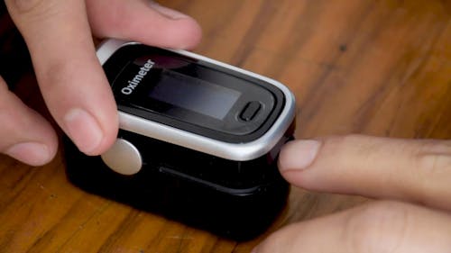 Person Using a Pulse Oximeter