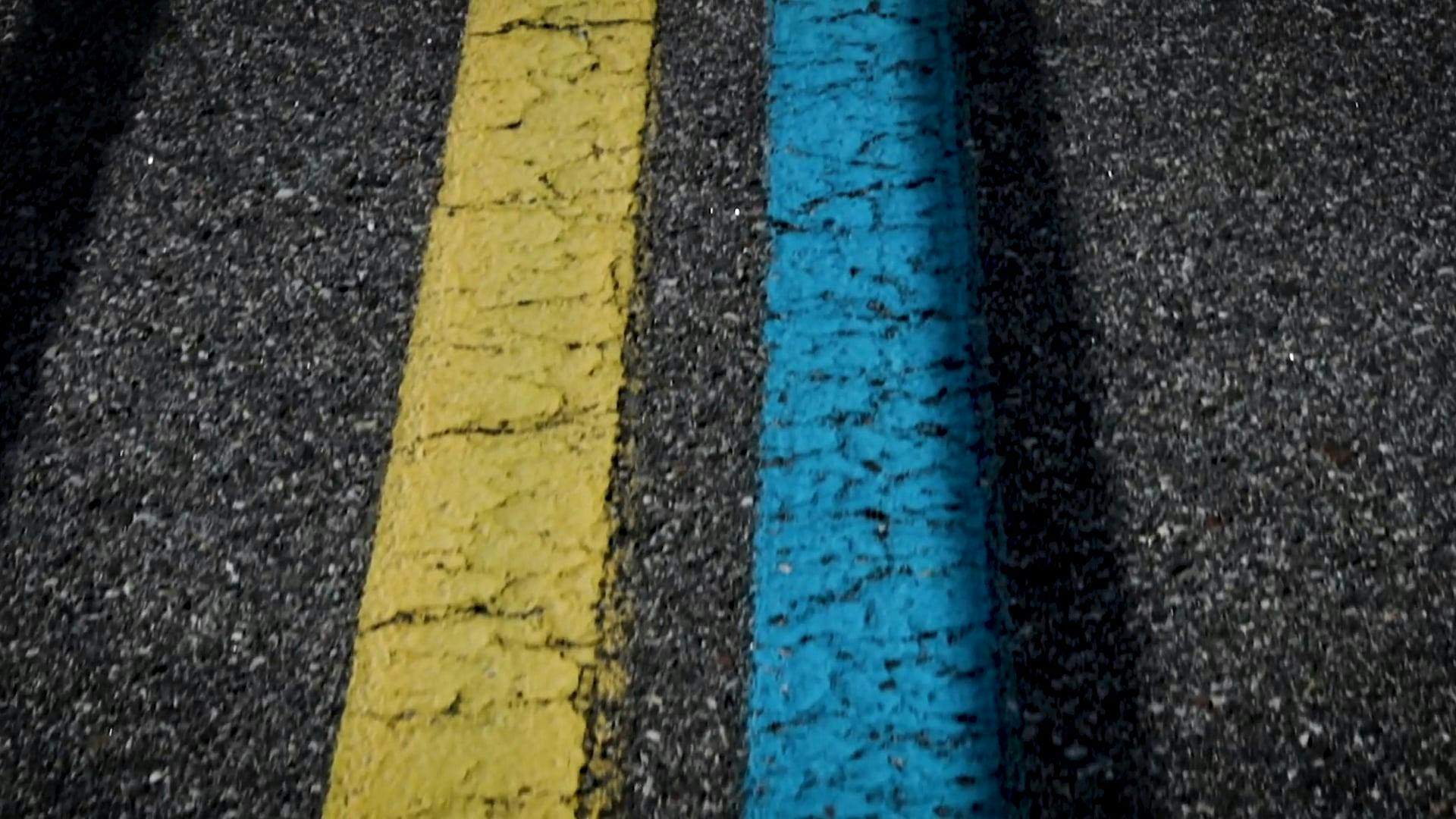 Broken Painted Lines In The Center Of A Two Way Traffic Road · Free Stock Video