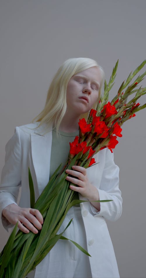 Woman Holding Red Flowers