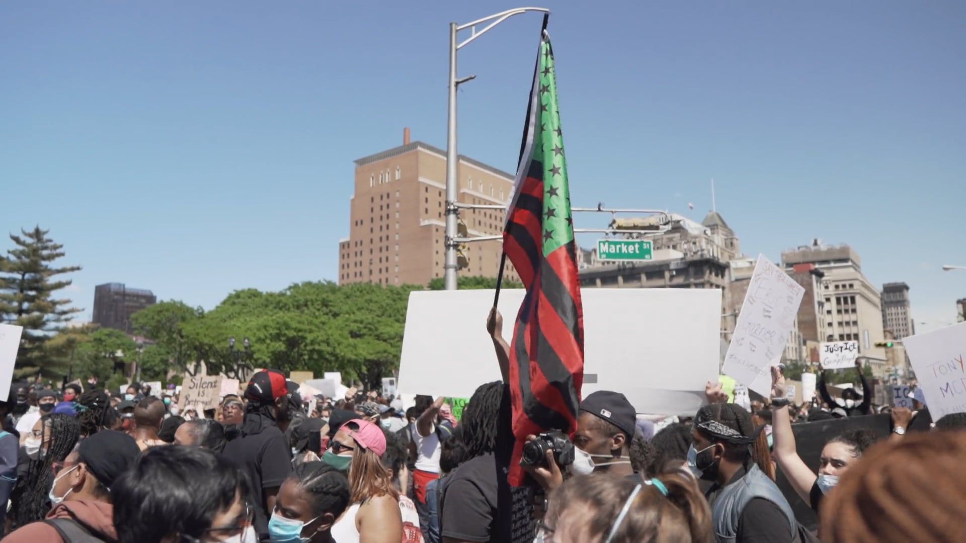 A Person Holding a Flag in a Protest Rally · Free Stock Video